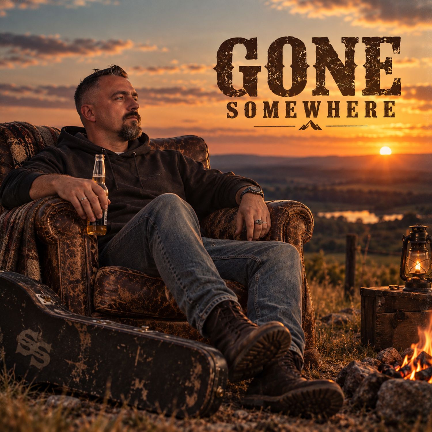 Gone Somewhere cover: Ste relaxing in an armchair at sunset